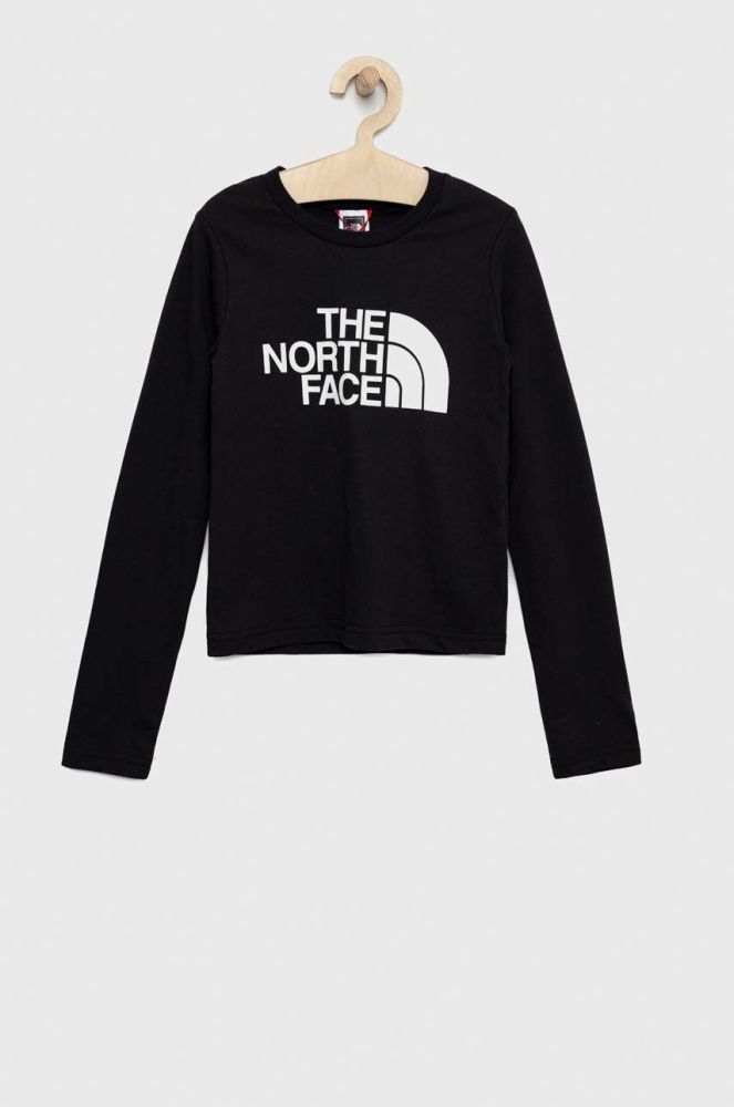 Дитячий бавовняний лонгслів The North Face колір чорний з принтом