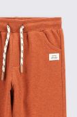 Дитячі спортивні штани Coccodrillo колір помаранчевий однотонні