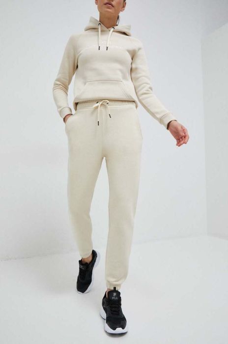 Спортивні штани Peak Performance жіночі колір бежевий однотонні (3080271)