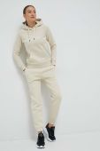 Спортивні штани Peak Performance жіночі колір бежевий однотонні (3080271)