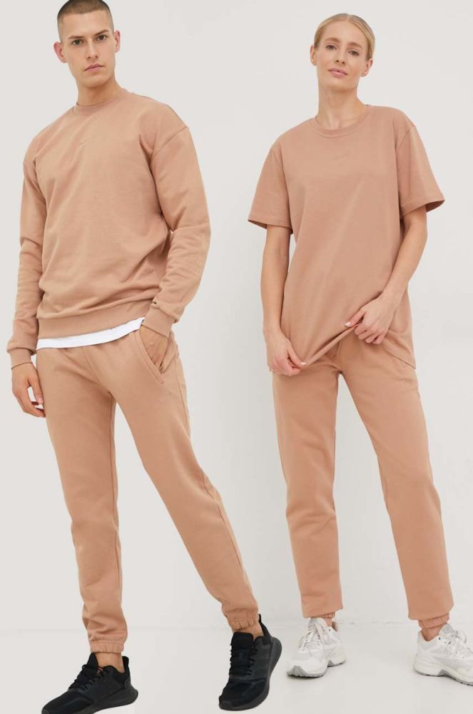 Бавовняні спортивні штани Arkk Copenhagen unisex колір бежевий однотонні
