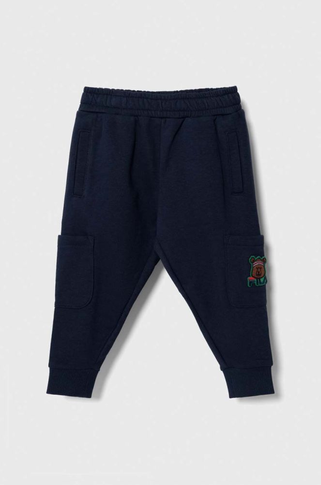 Дитячі спортивні штани Fila TETENBUELL track pants колір синій з аплікацією