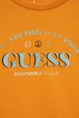 Дитячий бавовняний лонгслів Guess колір помаранчевий з принтом (3321925)