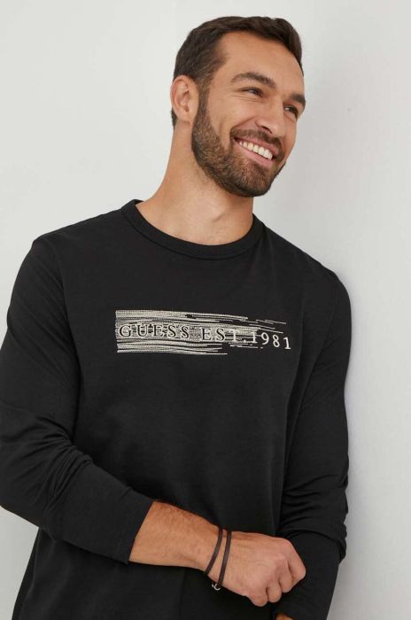 Бавовняний лонгслів Guess колір чорний з аплікацією