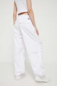 Штани Tommy Jeans жіночі колір білий широке середня посадка