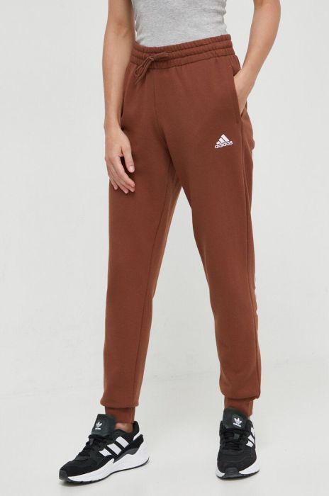 Бавовняні спортивні штани adidas колір коричневий з принтом