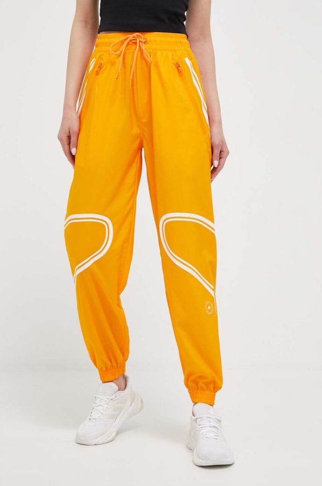 Штани для тренувань adidas by Stella McCartney TruePace колір помаранчевий з принтом