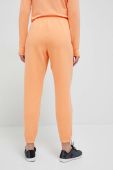 Спортивні штани Under Armour колір помаранчевий однотонні